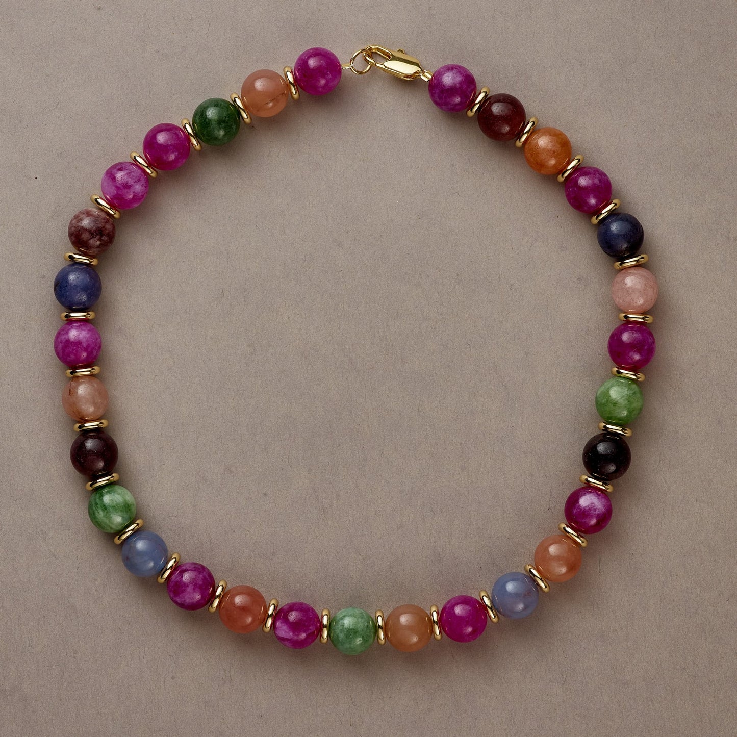 Rainbow Vibe necklace in full circle, showcasing the playful array of multicolored beads on a neutral background.