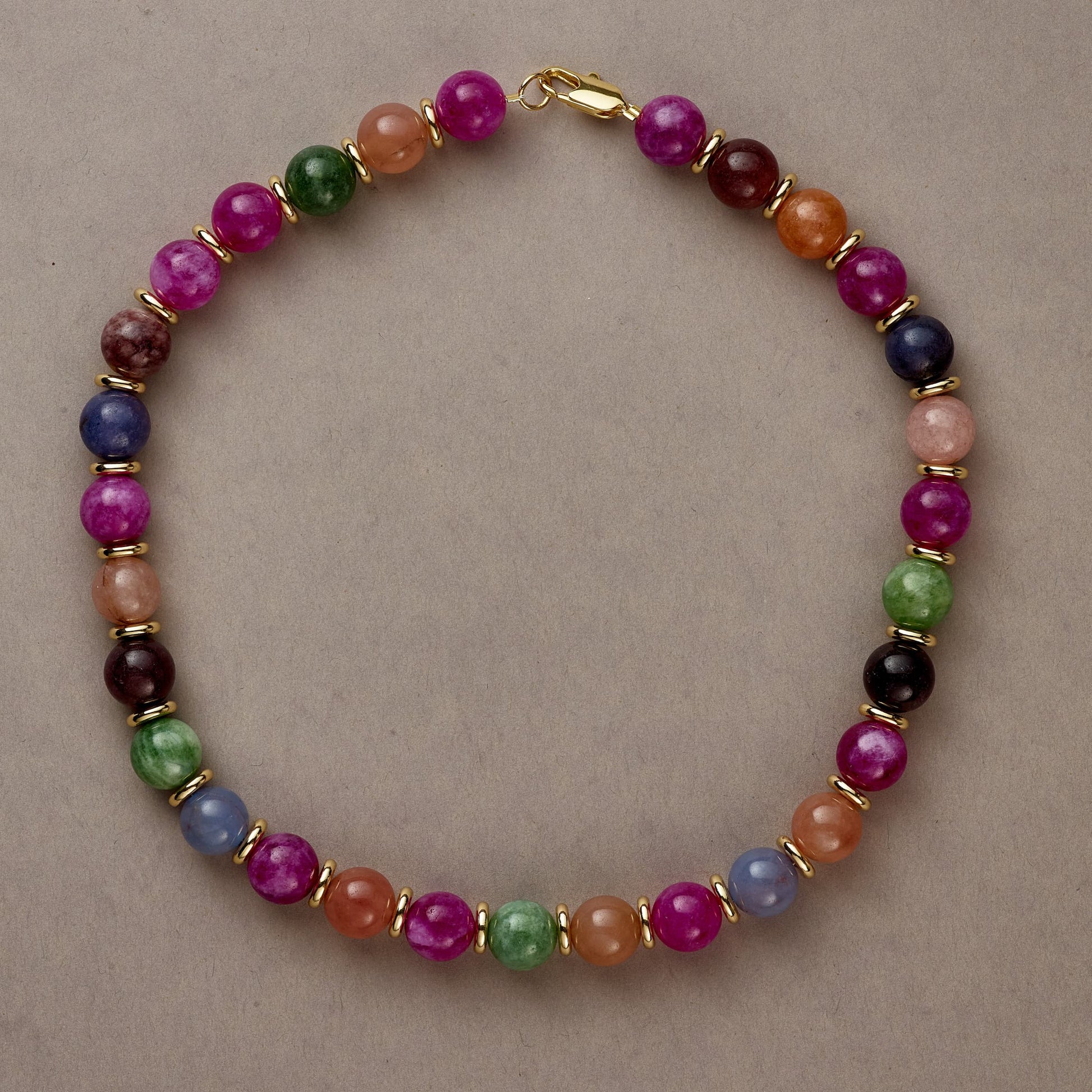 Rainbow Vibe necklace in full circle, showcasing the playful array of multicolored beads on a neutral background.