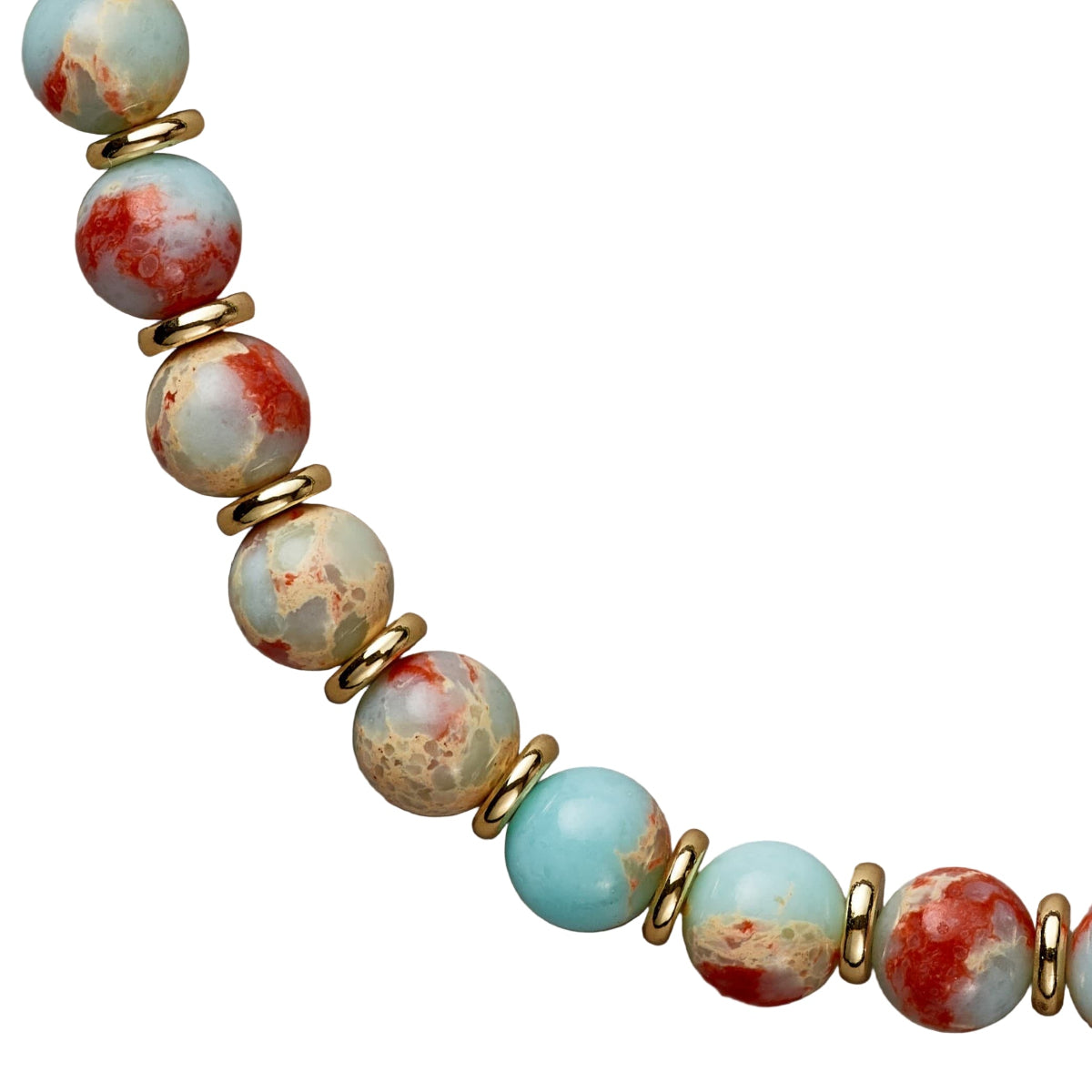 Necklace with turquoise and red marbled beads and gold accents on a beige background