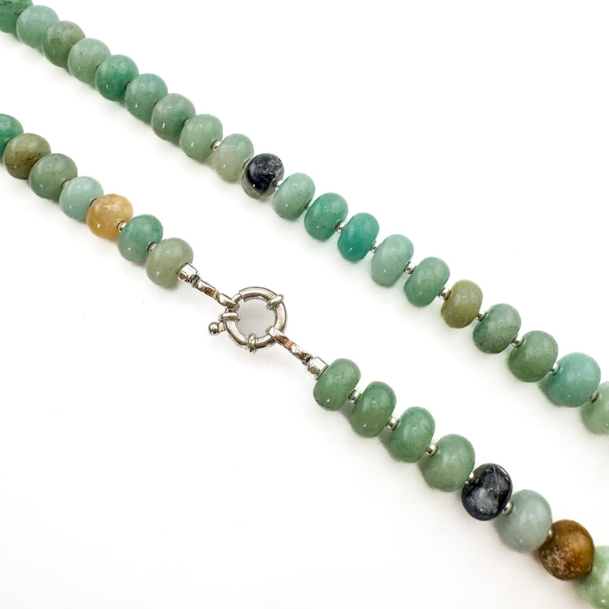 Necklace with green beads and a silver clasp on a white background
