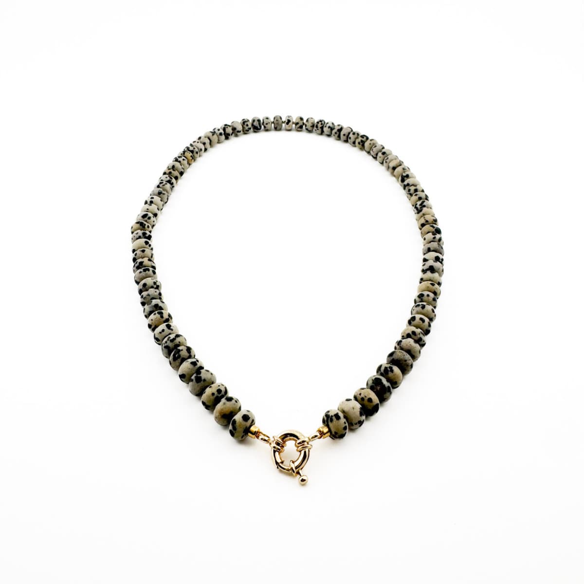Necklace with gray beads and a gold clasp on a white background