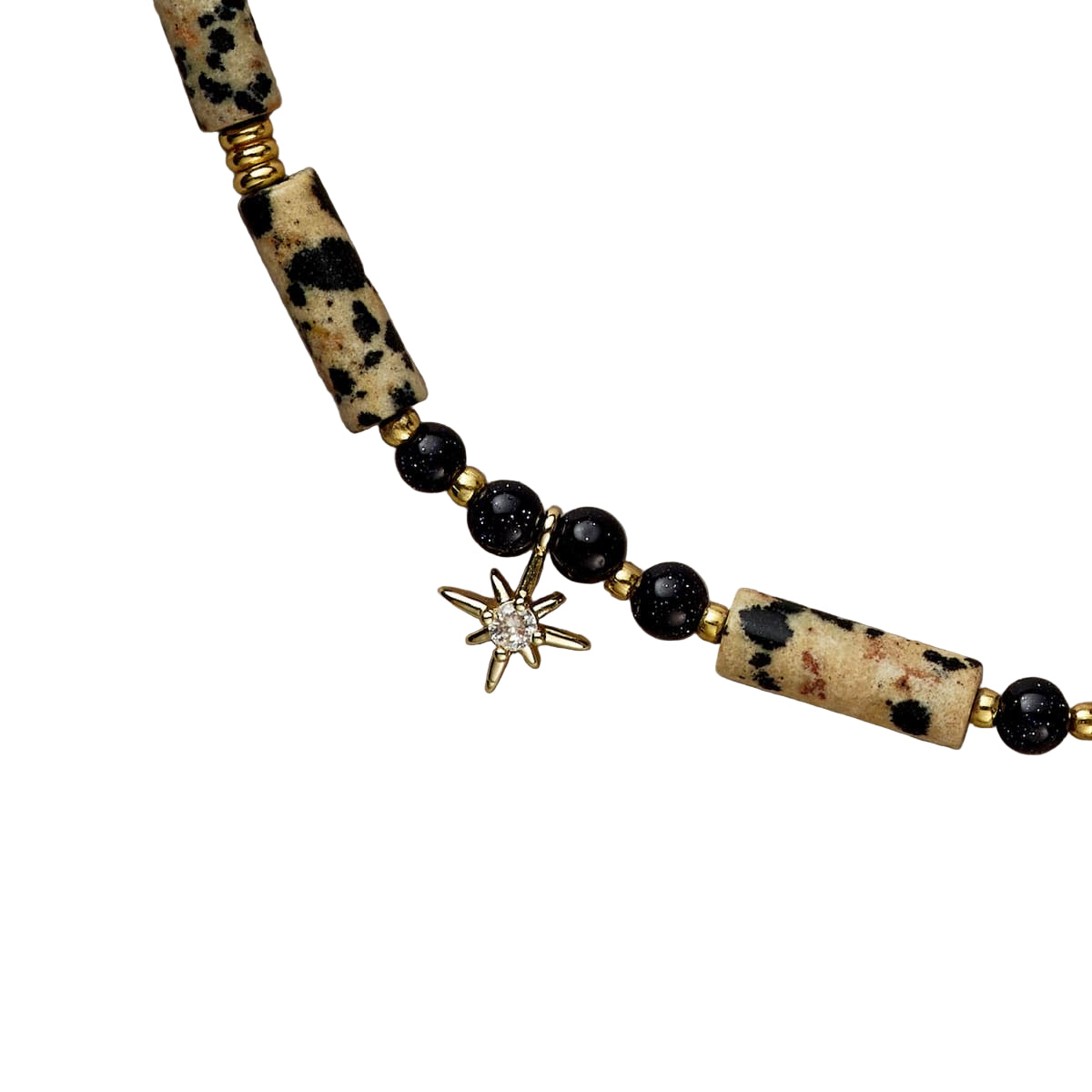 Necklace with black beads and a star-shaped pendant on a beige background