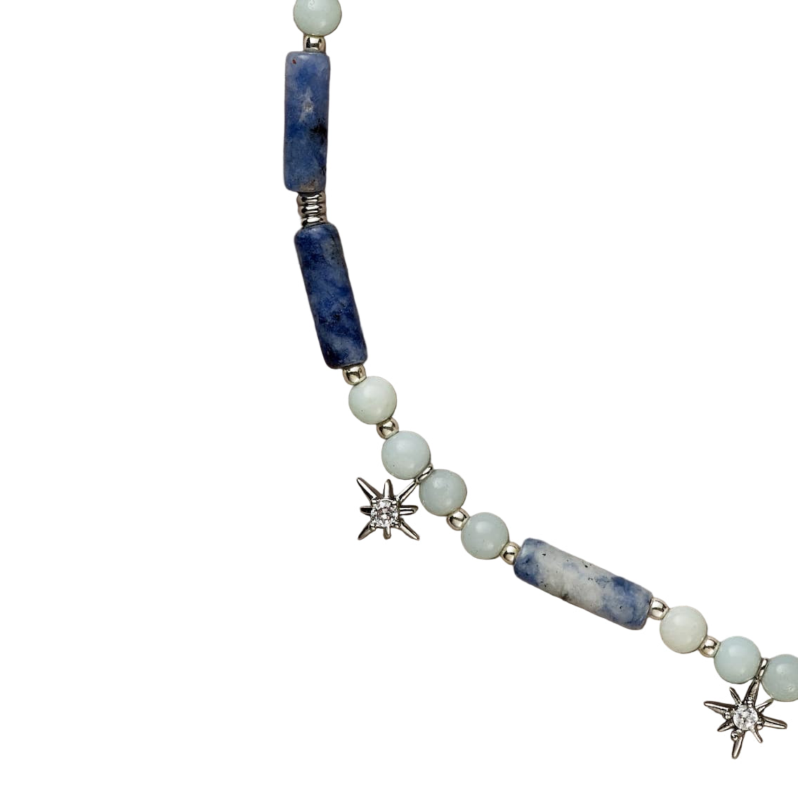 Necklace with blue and white beads on a beige background