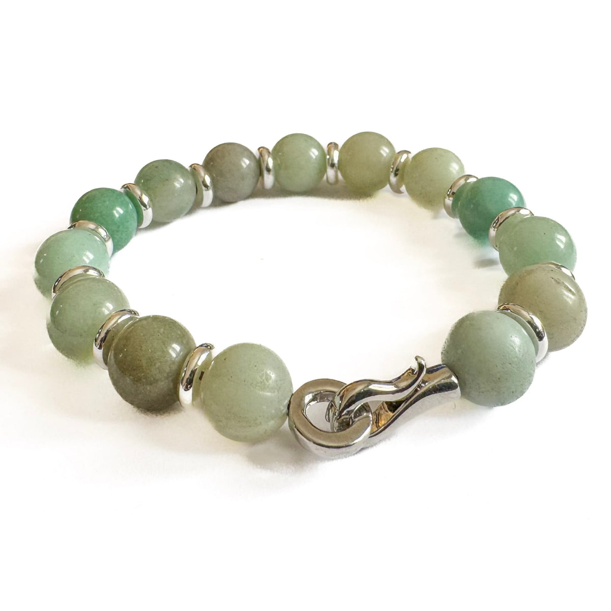 Green beaded bracelet with a silver clasp on a white background