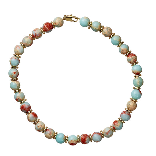 Necklace with multicolored beads on a beige background